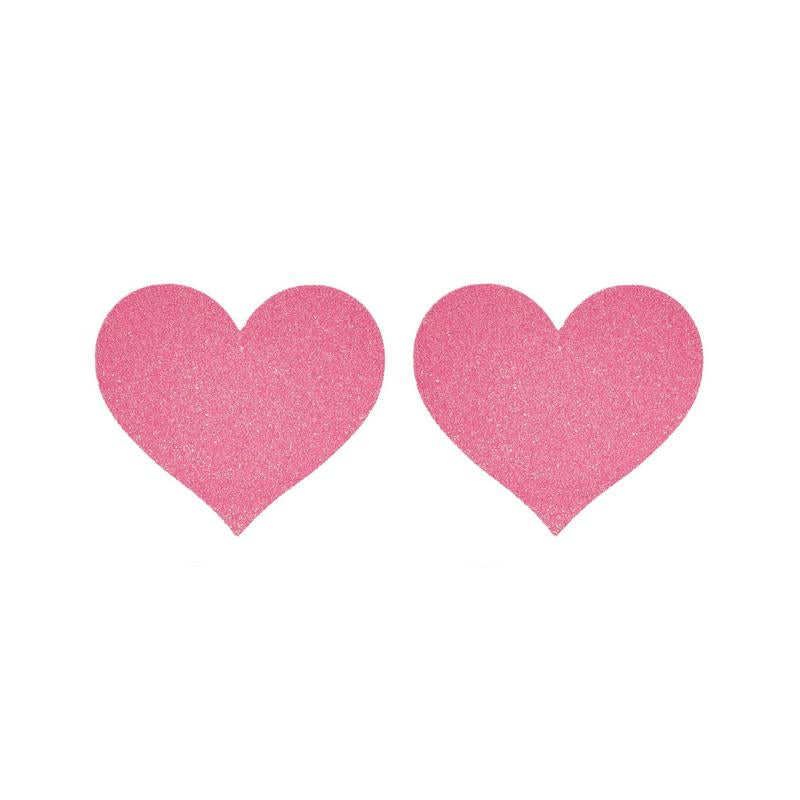 Two pink heart-shaped pasties on a white background