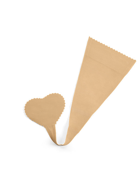 A tan heart-shaped adhesive breast lift tape features a long lifting tab with decorative scalloped edges.