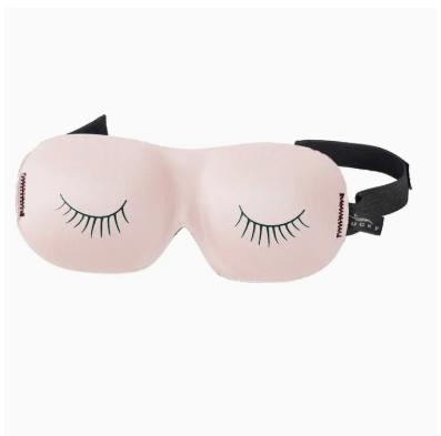 Pink sleep mask with eyelash designs on a white background