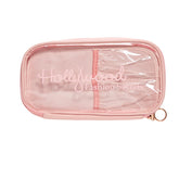 Pink transparent makeup pouch with 'Hollywood Fashion Secrets' text on a white background