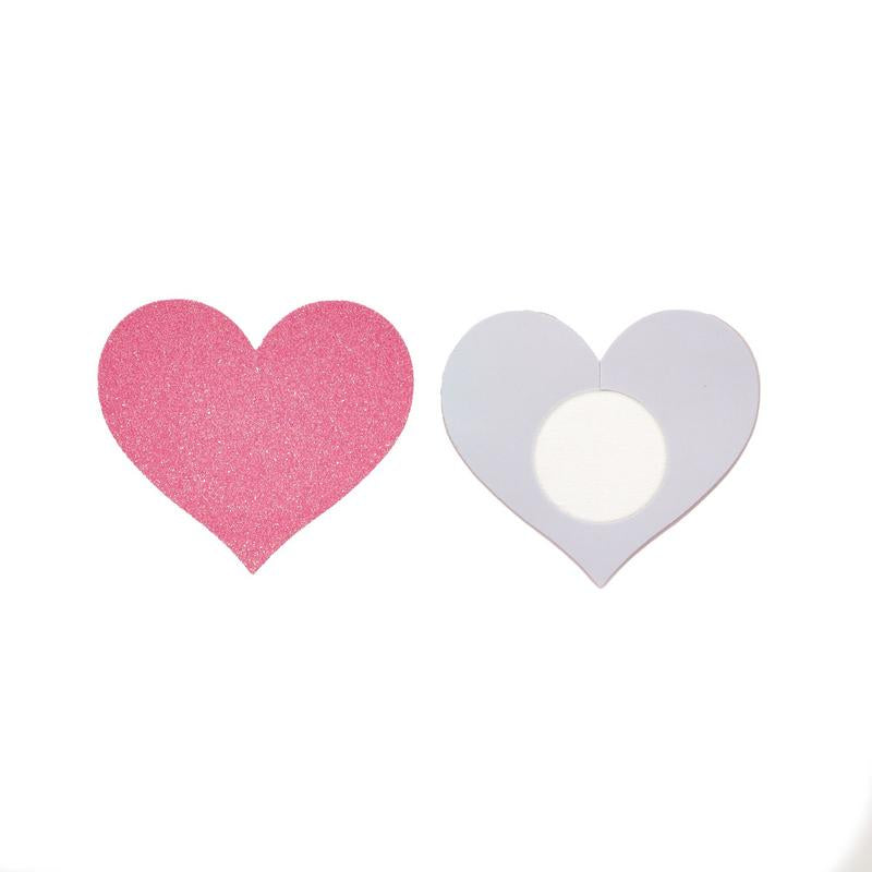 Two heart-shaped objects, one pink and one gray, on a white background.
