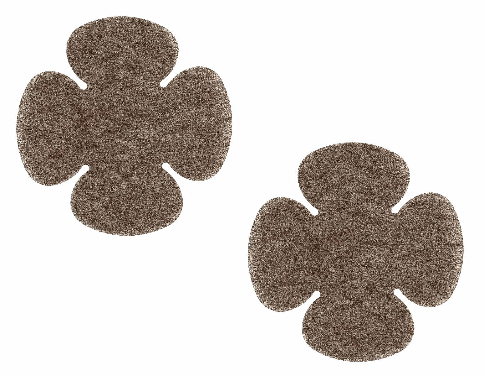 A pair of dark brown clover-shaped breast petals provides discrete coverage against a clean white background.
