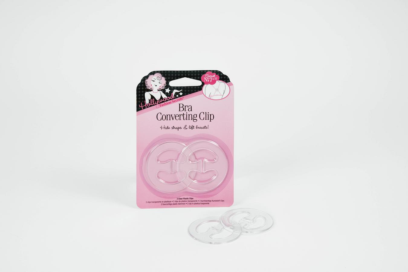 Hollywood Fashion Secrets bra converting clips feature two clear plastic racerback strap clips inside the pink packaging and two loose clips on a white surface.