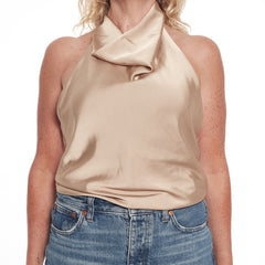 Beige halter top worn by a person on a white background