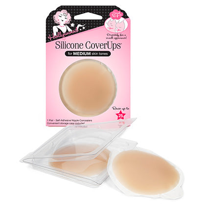 Reusable Hollywood Silicone CoverUps nipple concealers for medium skin tones sit next to their clear storage case and pink retail packaging.