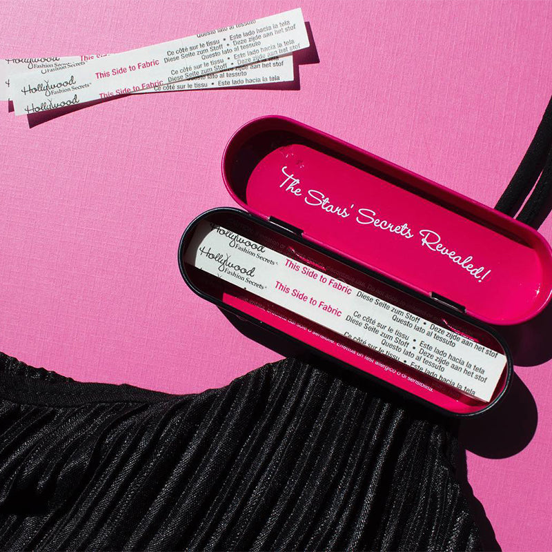 Pink case with 'The Stars' Secrets Revealed!' text, containing fabric swatches on a pink background.