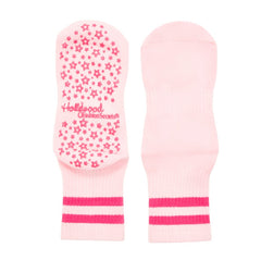 Pink grip socks with star pattern and 'Hollywood Secret' branding on a white background