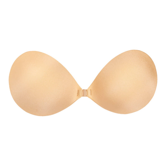 Backless and strapless adhesive bra with front clip closure.