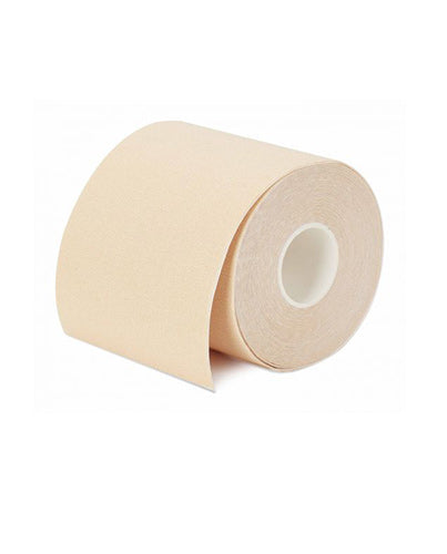 Roll of a body tape with light beige shade isolated on a white background