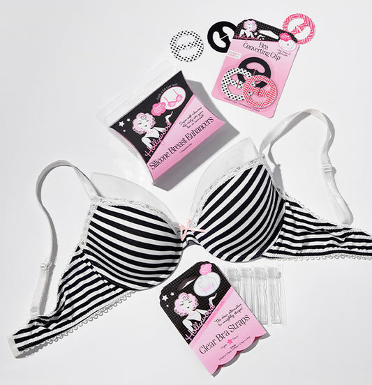 bra accessories displayed with a black and white striped bra, silicone breast enhancers, bra converting clip, and clear bra straps.