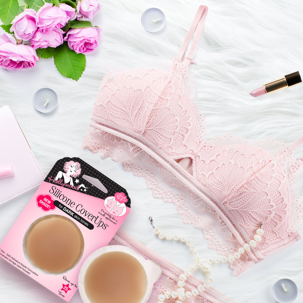 Flat lay of Hollywood Fashion Secrets Silicone CoverUps with lace lingerie, pearls, and beauty essentials for a chic aesthetic.