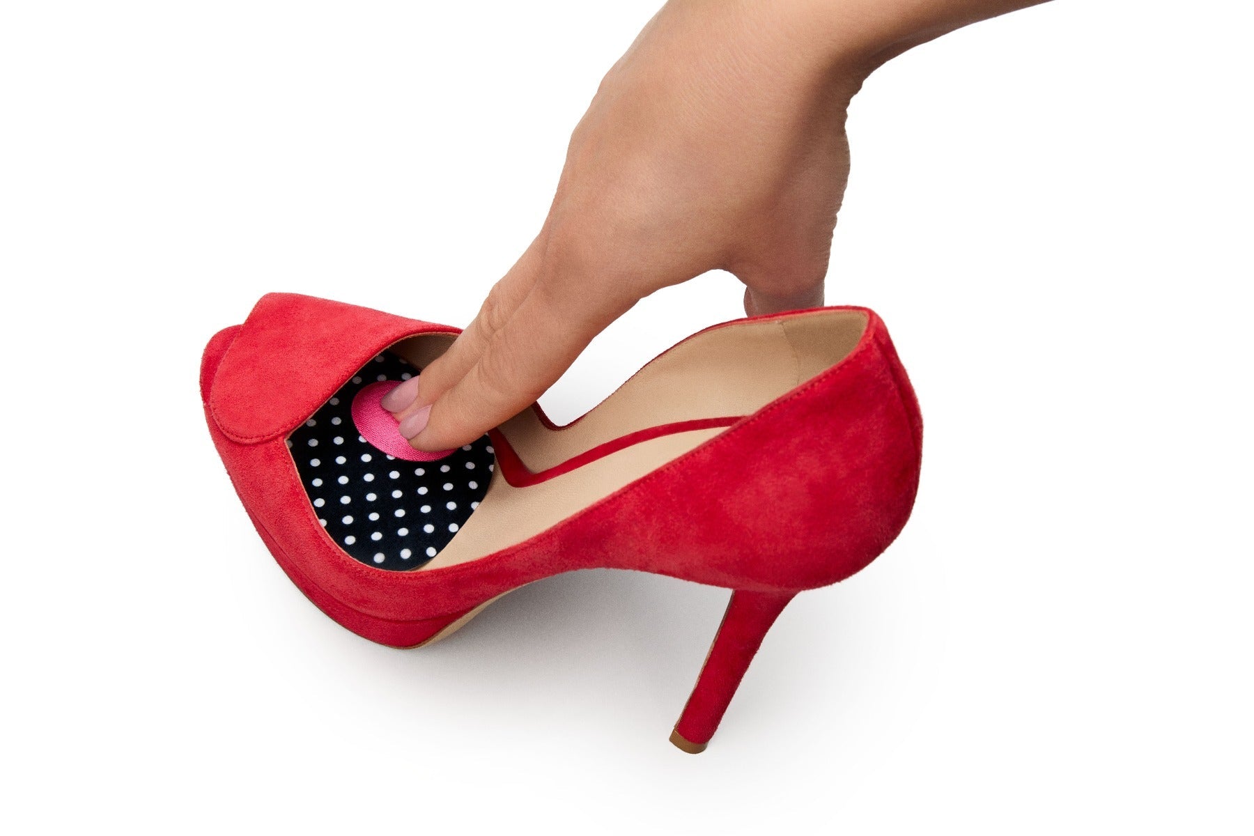 A lady finger putting on shoe pressure spotsA lady finger putting on shoe pressure spots