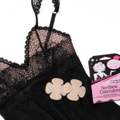 Hollywood Fashion Secrets No-Show Concealers placed on black lace lingerie, highlighting seamless and smooth coverage.