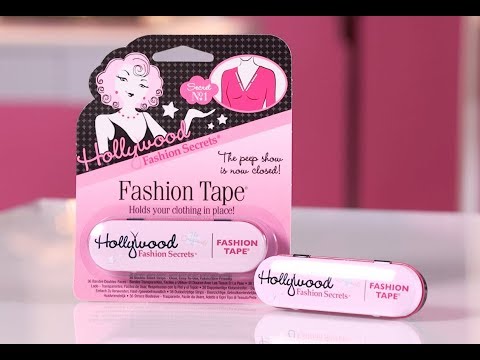 Hollywood Fashion Secrets Fashion Tape pack and tin displayed on a counter top.