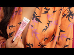 Woman holding Hollywood Fashion Secrets Liquid Fashion Tape in a stylish robe, showcasing its secure, no-show hold for wardrobe fixes.