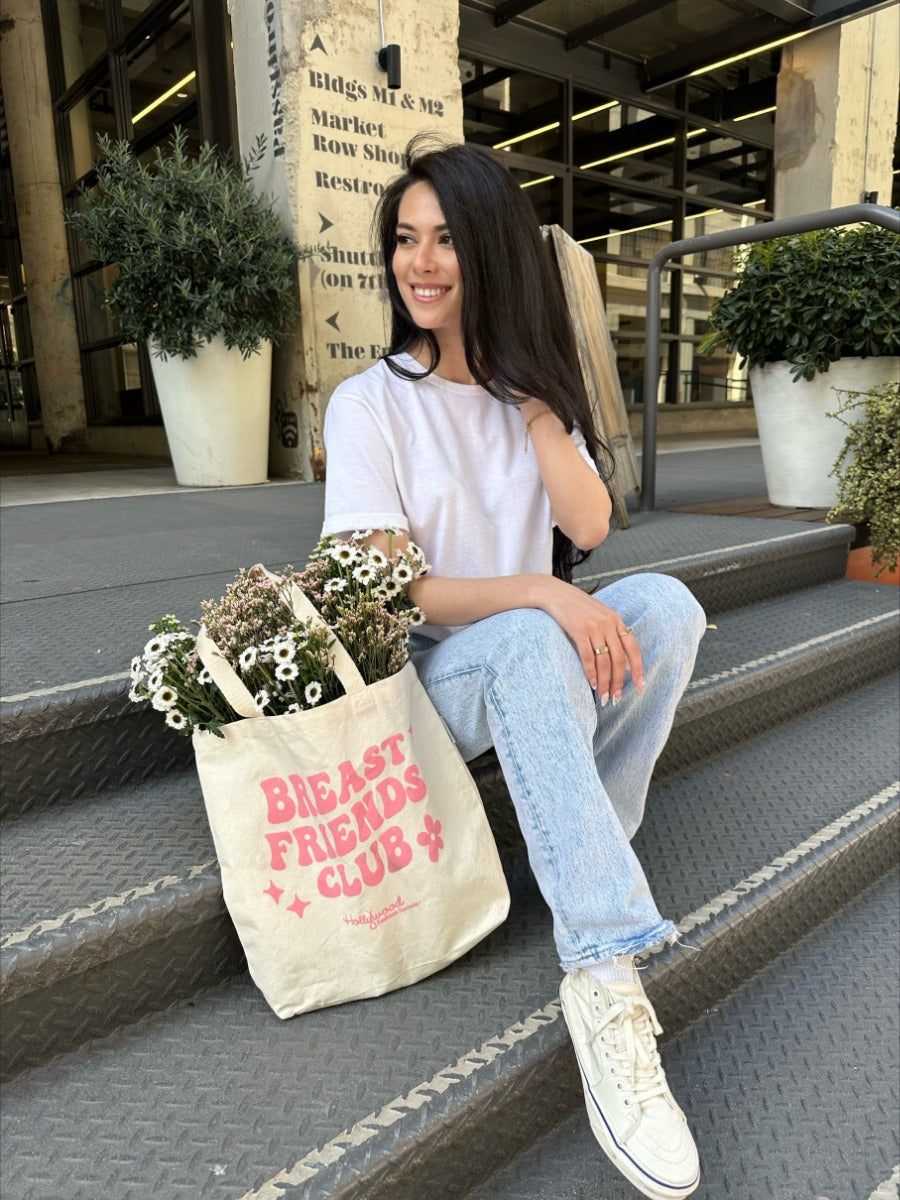 Image of model wearing Hollywood Fashion Secrets Breast Friends Jersey Cotton T-shirt front of shirt with matching Breast Friends Club canvas tote 
