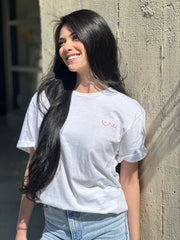 Image of model wearing Hollywood Fashion Secrets Breast Friends Jersey Cotton T-shirt with small printed breast illustration on front of shirt located on upper left chest area
