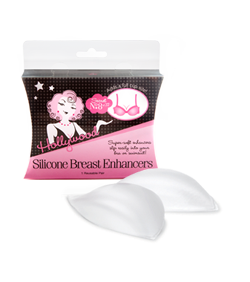 A pair of clear Hollywood Fashion Secrets silicone breast enhancers sits in front of their pink and black retail packaging.